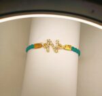 Classy Golden Design N Zircon Green Lather Bracelet / Watch For Girls / Women